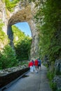 Visitors under the Rock Arch at Natural Bridge State Park, Virginia, USA Royalty Free Stock Photo